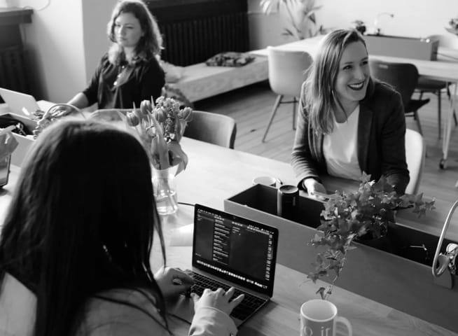 Happy people working on computers